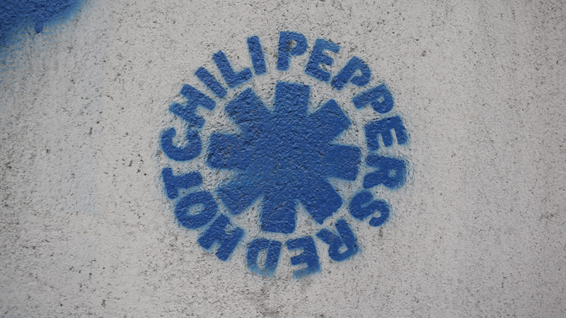 Blue logo of red hot chili pepper